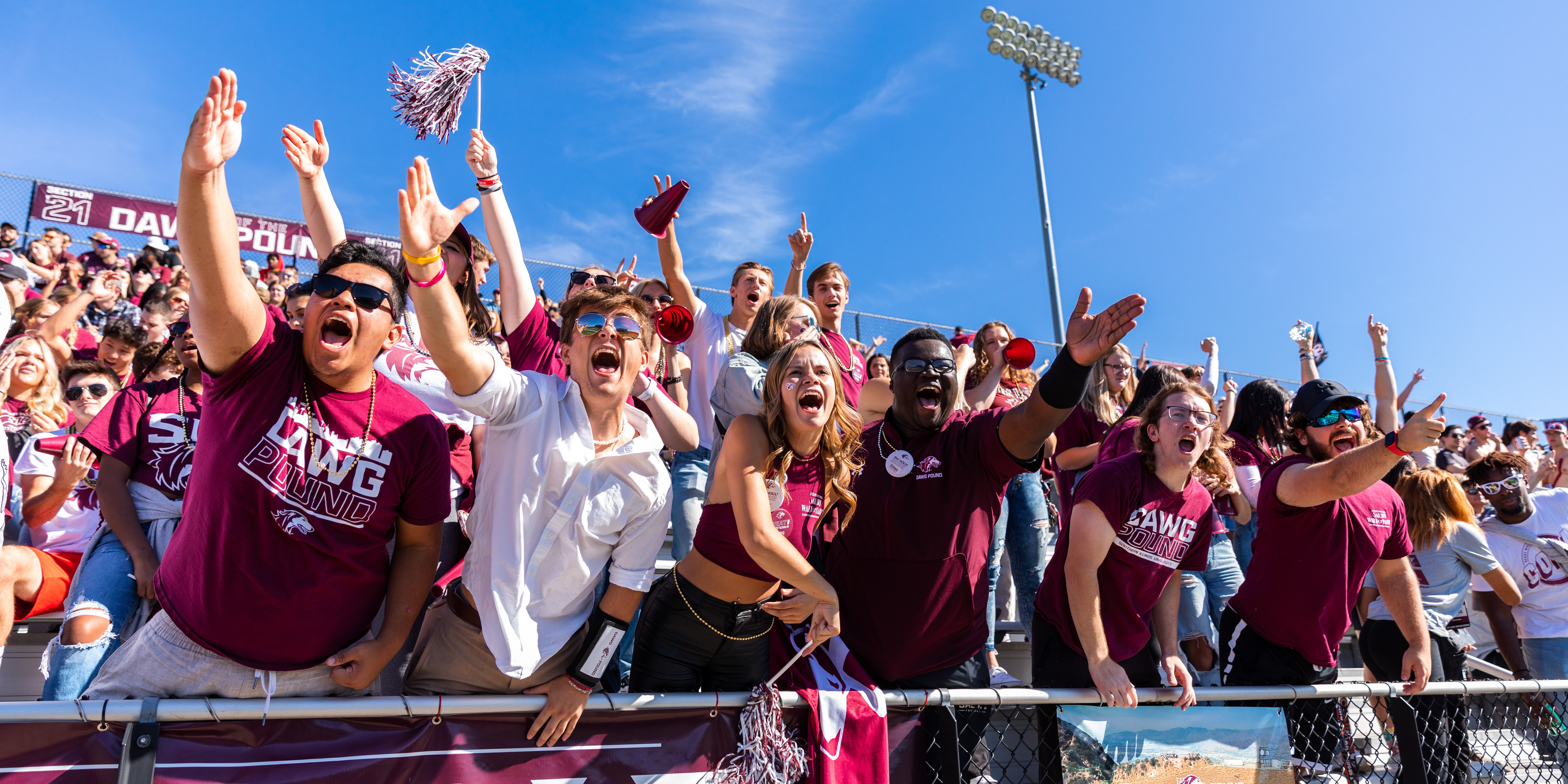 Students cheering at a football game